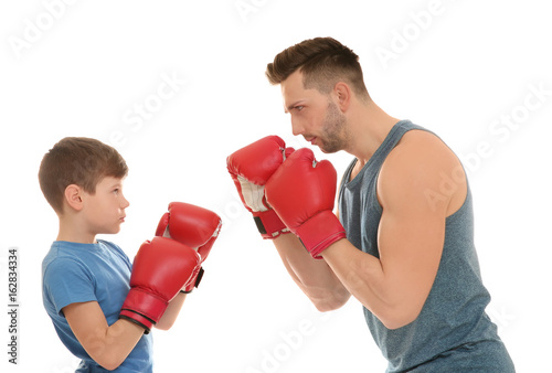 Dad and son in boxing glove...