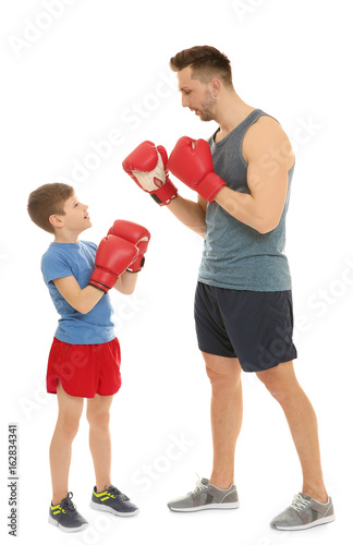Dad and son in boxing glove...