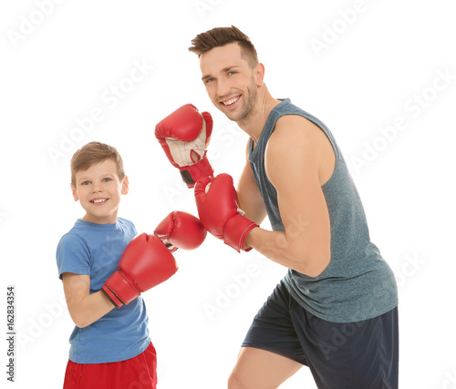 Dad and son in boxing glove...