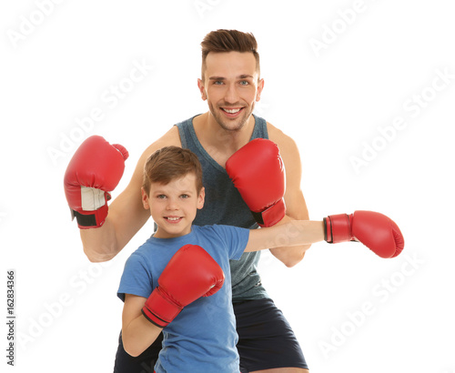 Dad and son in boxing glove...