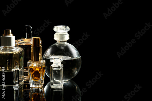 Perfume bottles on black background