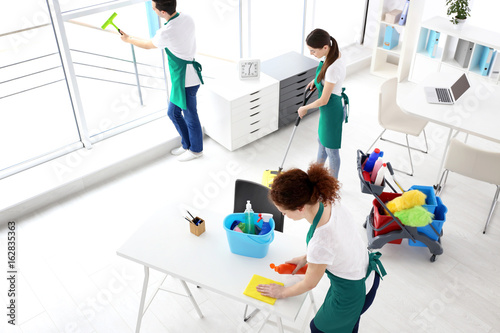 Service team cleaning office