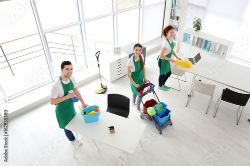 Service team cleaning office
