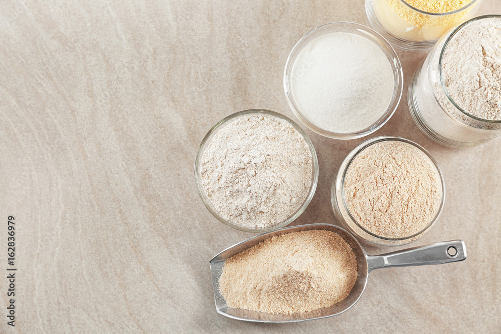 Naklejka Composition with different types of flour on table