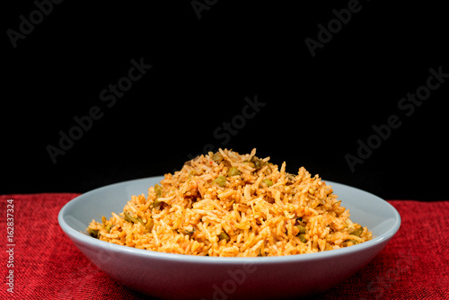 Homemade Chinese fried rice with vegetables and fried eggs