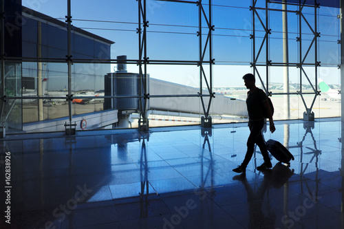 Man walking with luggage in the airport