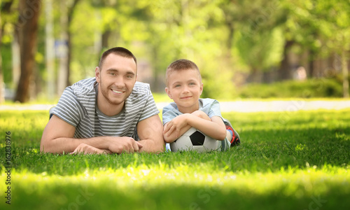 Father and son with soccer ...