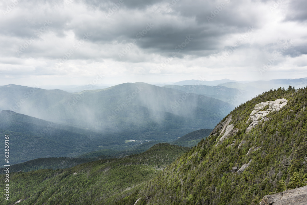 Fototapeta premium Rain Showers Falling on an Adirondack Valley