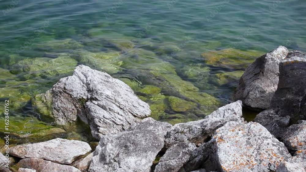 Nature of Lake Baikal. Stones on the shore of the lake Nature of Lake Baikal. Stones on the shore of the lake