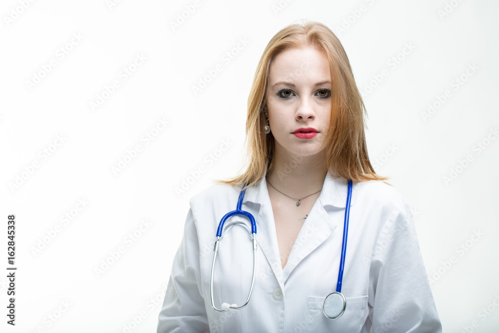 Serious attractive young woman doctor or nurse Serious attractive young woman doctor or nurse