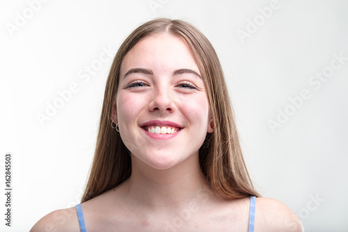 Cute young woman with a charismatic grin