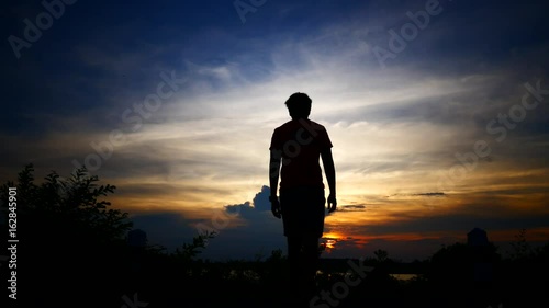 Young man sad and stressed during sunset.