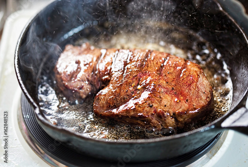 Photography Angus teak fried on vegetable oil on iron cast