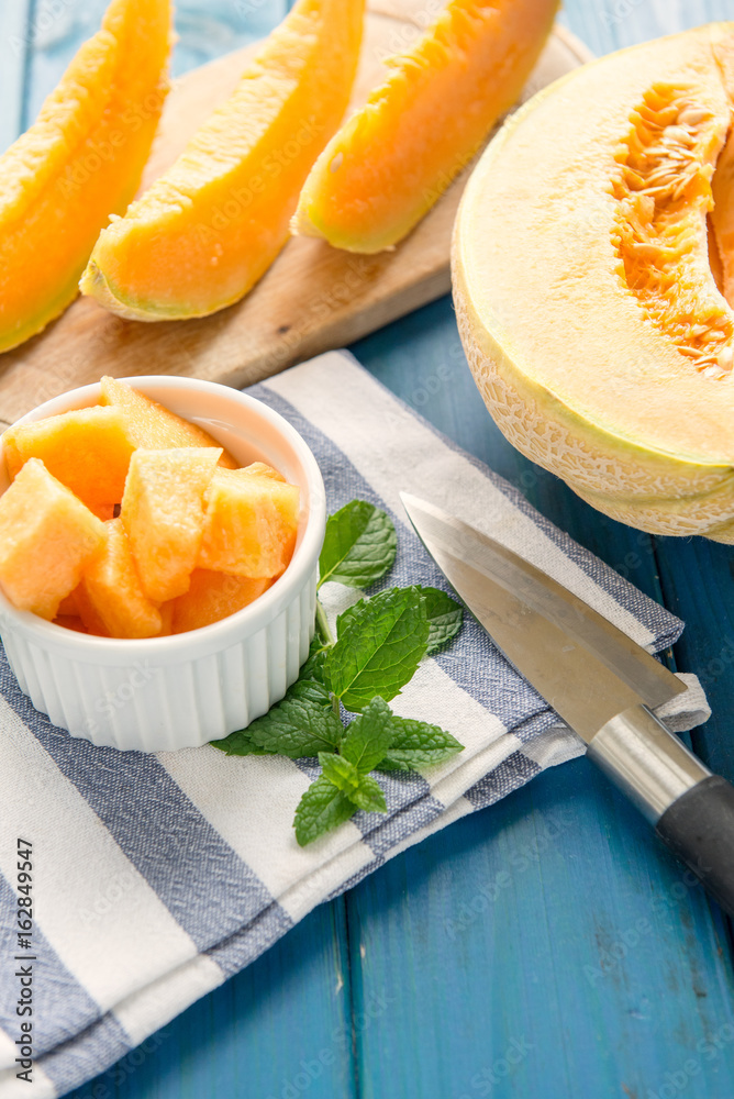 cantaloupe melon on the wooden table cantaloupe melon on the wooden table