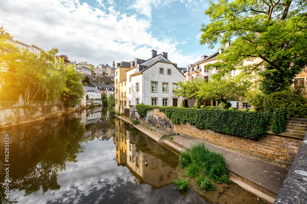 Sunset view on the old buildings near the river in Grund district of the old town of Luxembourg city