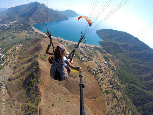 Fly in the sky above laguna Paragliding tandem