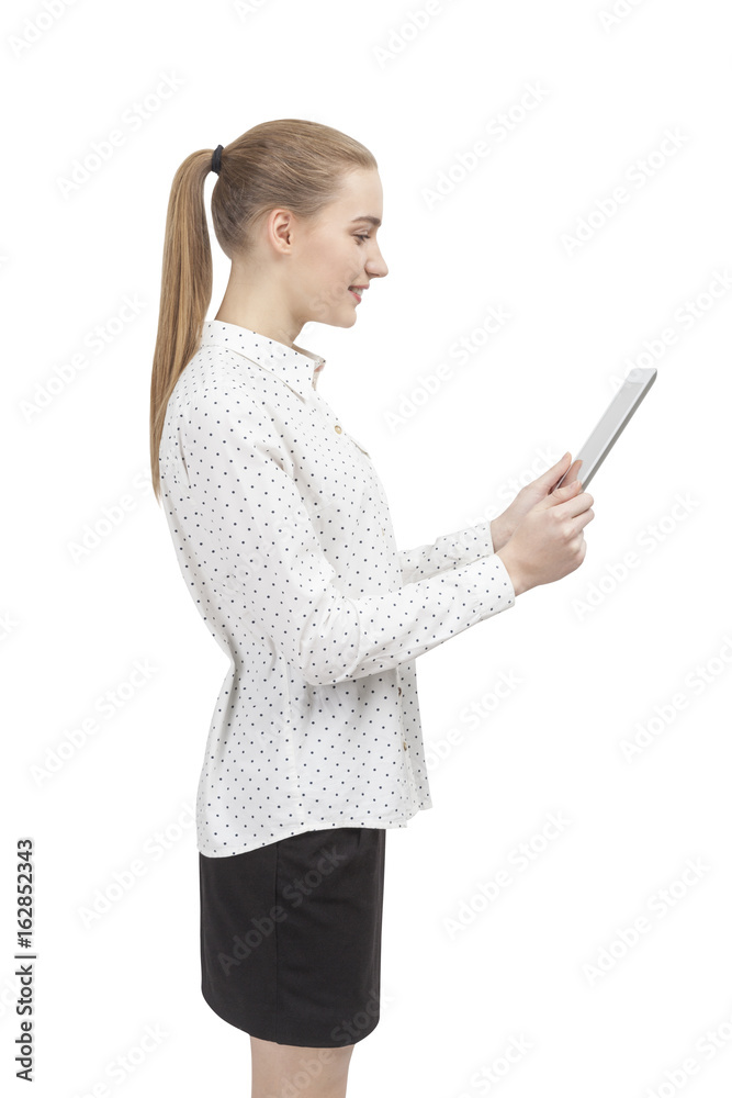 Blond woman with a tablet, side view isolated Blond woman with a tablet, side view isolated