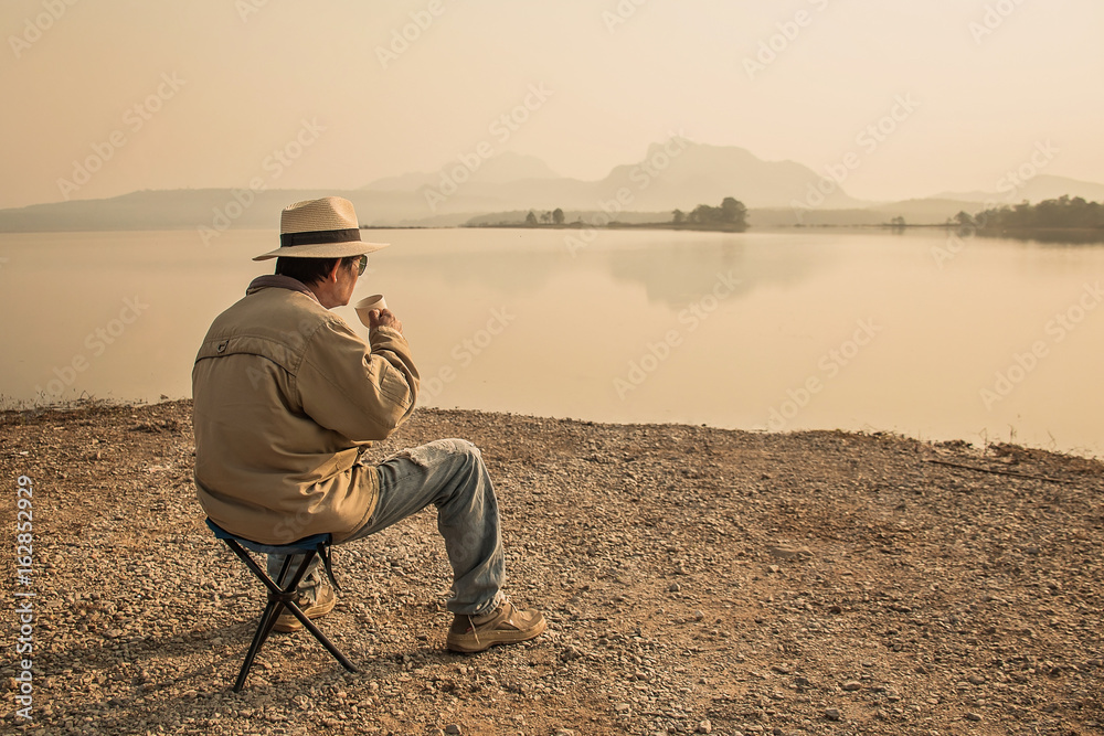 Fototapeta premium Young man drinking coffee in the moning