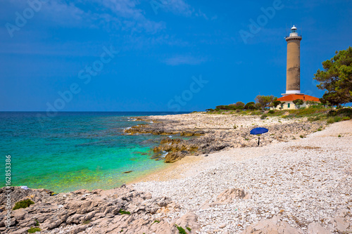 Veli Rat lighthouse and turquoise beach view photo