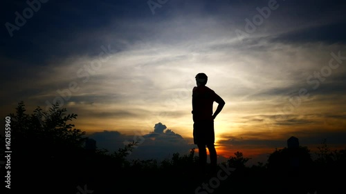 Young man sad and stressed during sunset.
