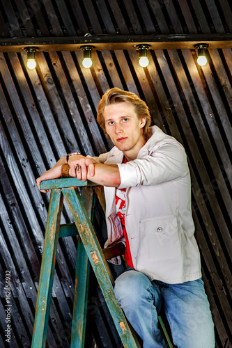 Fototapeta Naklejka Na Ścianę i Meble -  Young attractive guy posing in studio