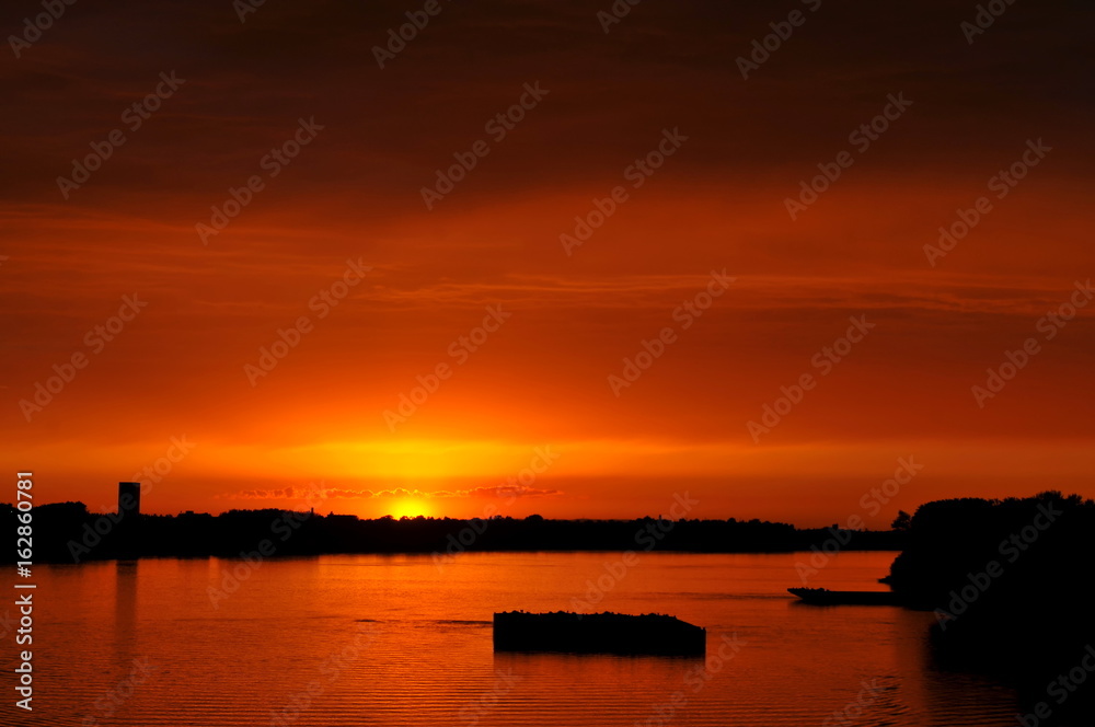 Orange sunset over river