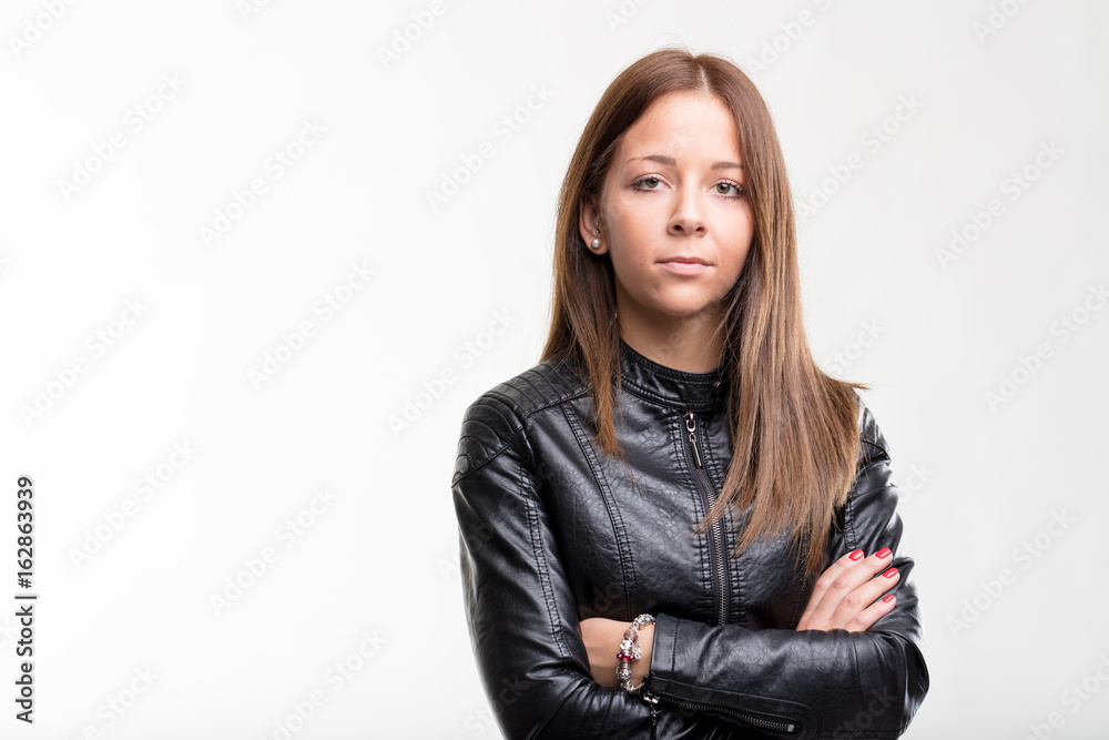 Confident young teenage woman in a leather jacket Confident young teenage woman in a leather jacket