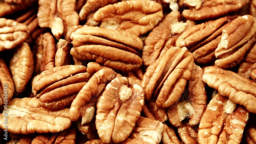 Food background. Pecan nuts close up. Dieting concept. Dolly slider shot 4K ProRes HQ codec Food background. Pecan nuts close up. Dieting concept. Dolly slider shot 4K ProRes HQ codec