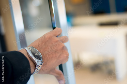 Businessman Entering an Office © apichart609