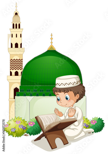 Little boy praying at mosque