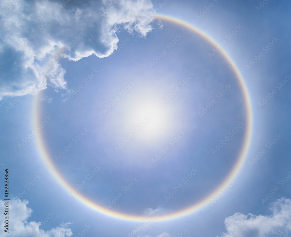 Blur sun halo with cloud in the blue sky.