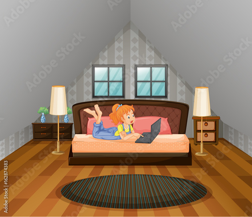Girl working on computer in bedroom