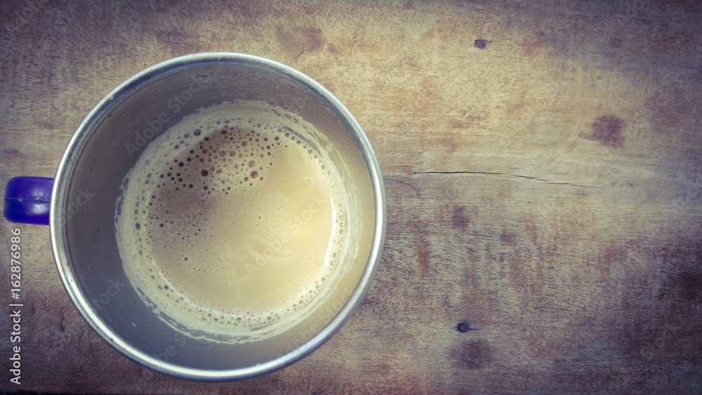 coffee in cup on wood background with dark shadow shed coffee in cup on wood background with dark shadow shed