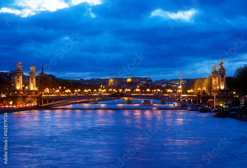 Alexandre III Bridge at blue night , Paris, France, retro toned