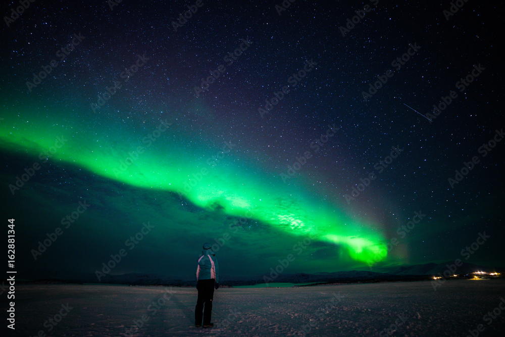 Girl watching the Northern Lights. Abisko Sweden