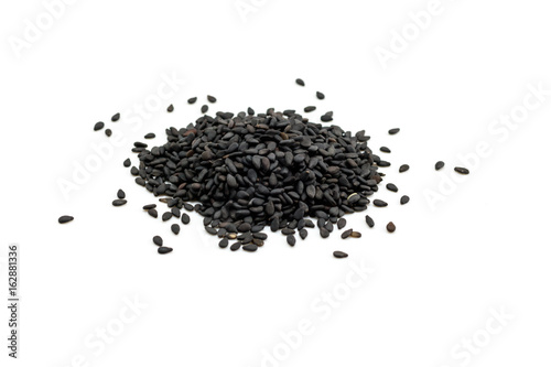 Black Sesame Seeds on white background. Composition isolated over the white background.