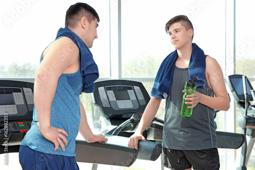 Dad and son training in mod...