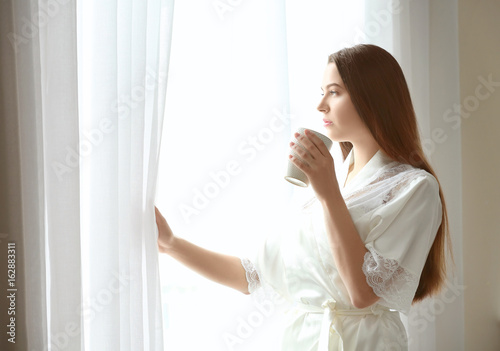 Beautiful woman drinking co...