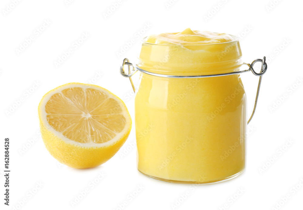 Glass jar with yummy lemon curd on white background Glass jar with yummy lemon curd on white background