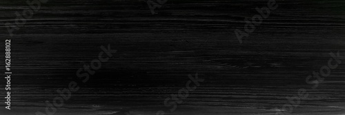 Dark wood texture background surface with old natural pattern or dark wood texture table top view. Grunge surface with wood texture background. Vintage timber texture background.Rustic table top view