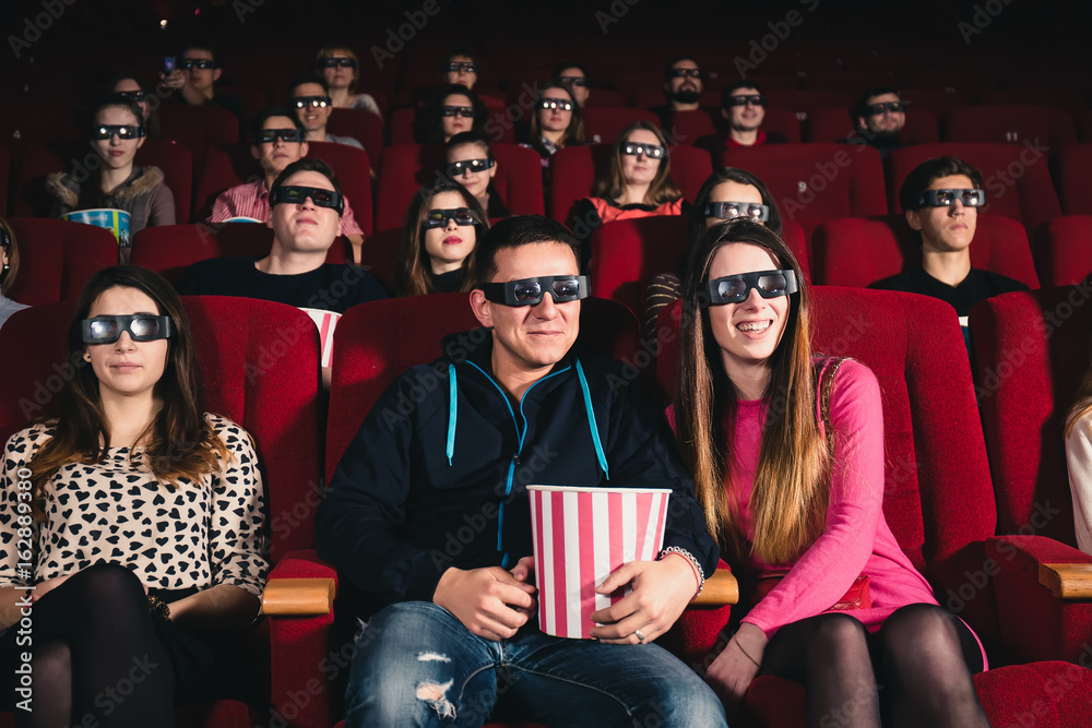 A couple in love in a movie theater on watching 3D A couple in love in a movie theater on watching 3D