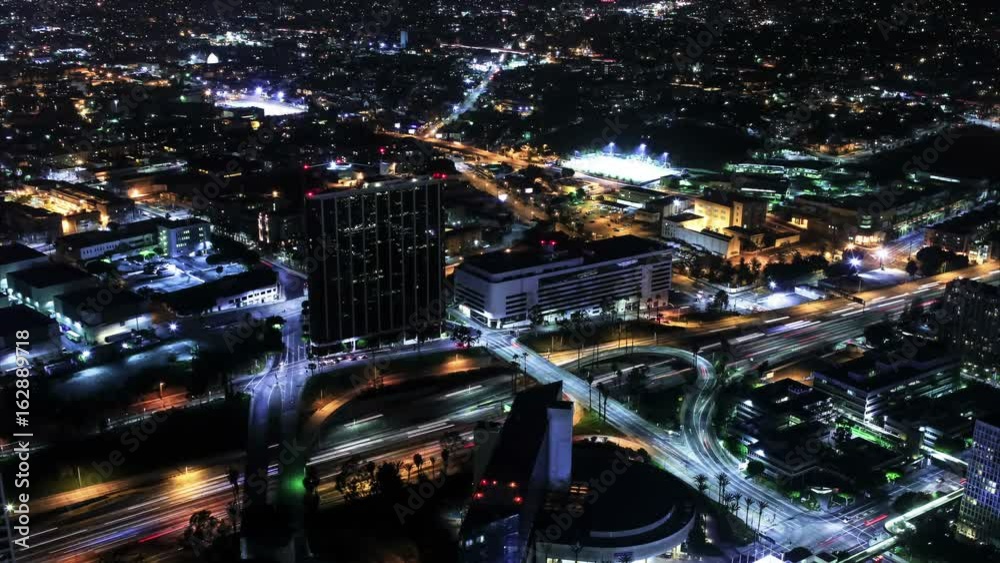 Los Angeles Downtown Aerial Time Lapse View of Night Cityscape and Busy Traffic Los Angeles Downtown Aerial Time Lapse View of Night Cityscape and Busy Traffic