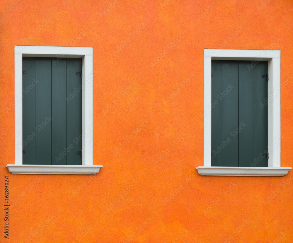Fototapeta premium Orange old wall with two windows, Burano