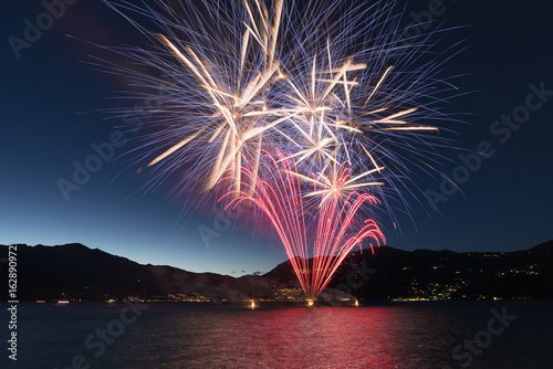 Fireworks on the lake in a summer night