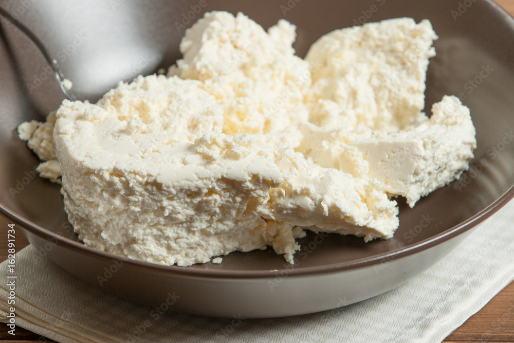 Homemade Cottage Cheese In Bowl. Soft Cheese.