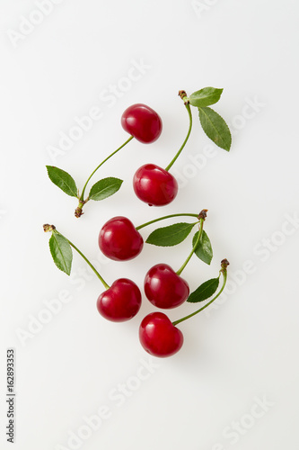 Fotótapéta Sour cherries on white background. Organic sour cherry, ripe.