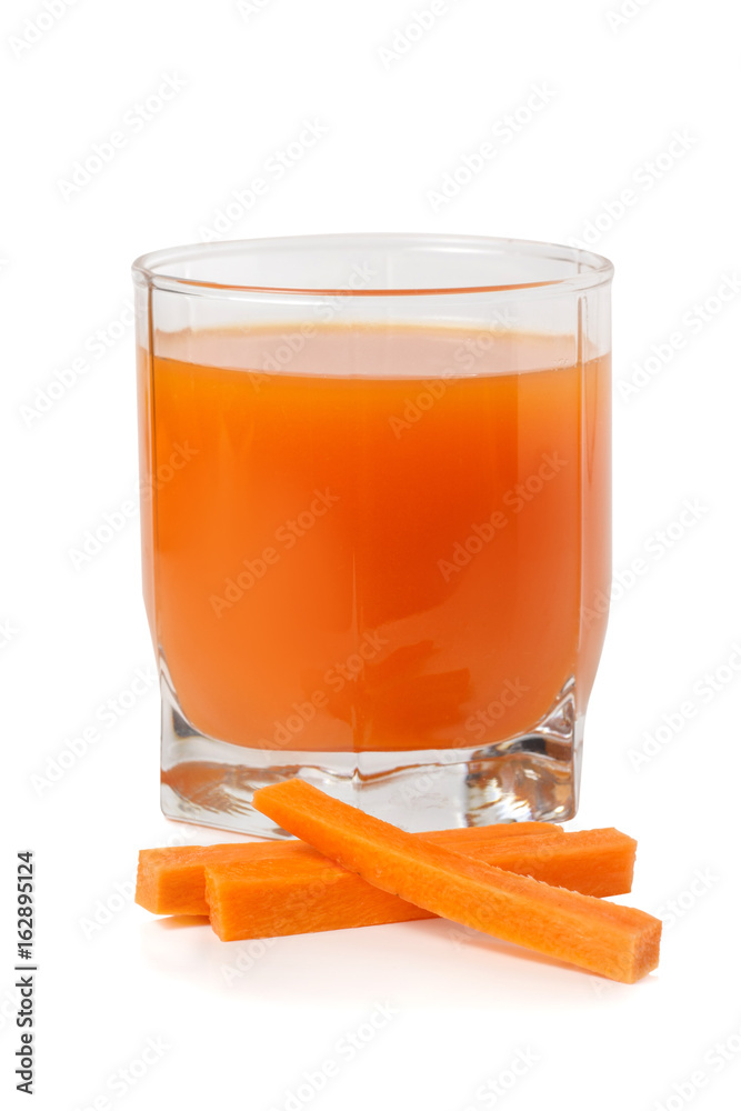 Carrot juice in a transparent glass with pieces of carrot Carrot juice in a transparent glass with pieces of carrot