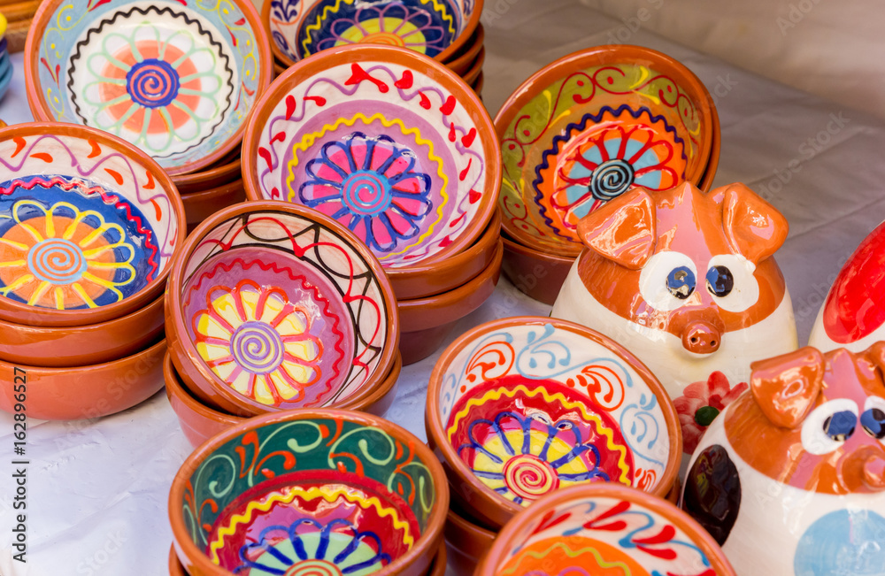 Colorful ceramic bowls at the tourist market of Valencia