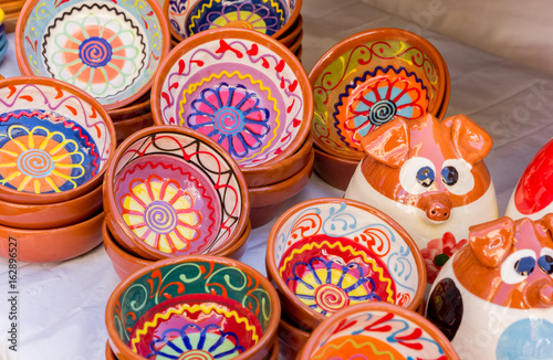 Colorful ceramic bowls at the tourist market of Valencia