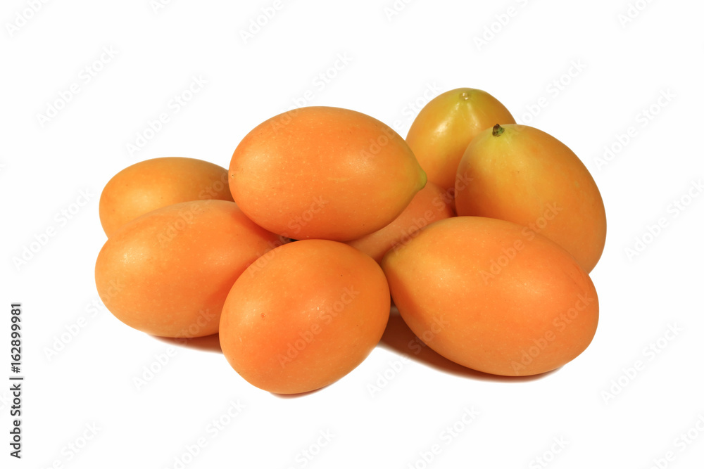 Closed up Pile of Bright Orange Yellow Ripe Marian Plums Isolated on White Background Closed up Pile of Bright Orange Yellow Ripe Marian Plums Isolated on White Background